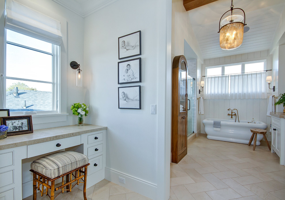 Inspiration for a large country master bathroom in Orange County with shaker cabinets, white cabinets, a freestanding tub, an alcove shower, a two-piece toilet, white tile, subway tile, white walls, travertine floors, an undermount sink, quartzite benchtops, beige floor, a hinged shower door and beige benchtops.