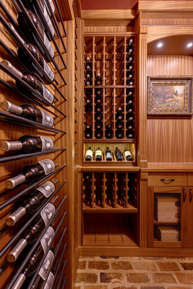 Secret passageway wine cellar. Basement layout with all mahogany racking.