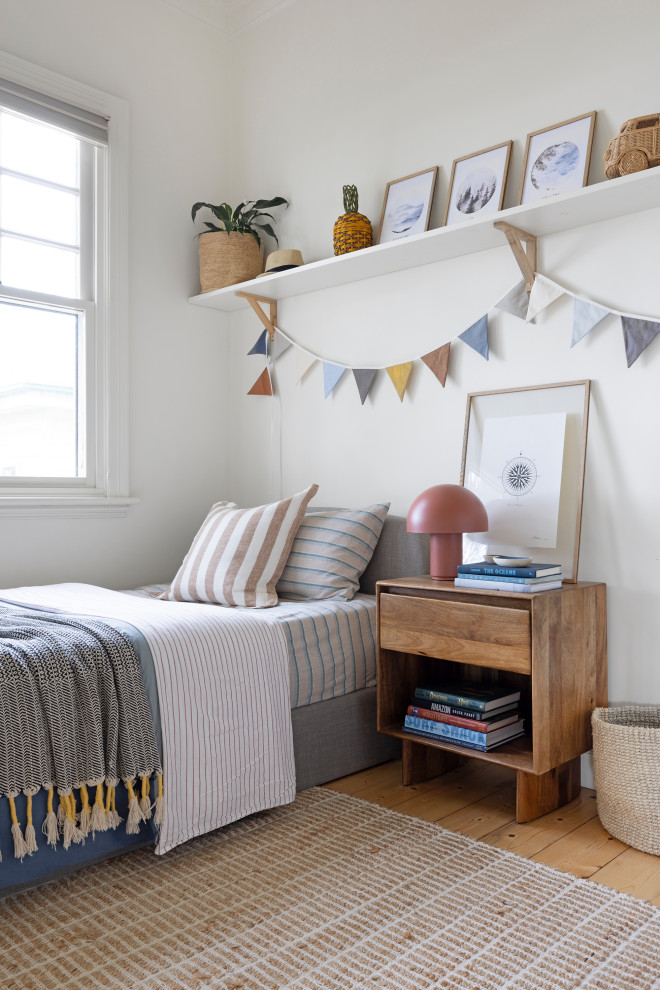 Inspiration for a contemporary kids' bedroom for kids 4-10 years old and boys in Wollongong with white walls, medium hardwood floors and brown floor.