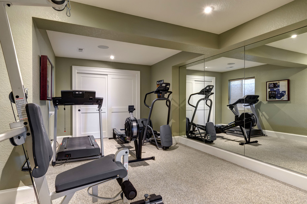 This is an example of a mid-sized traditional multipurpose gym in Denver with green walls, carpet and grey floor.