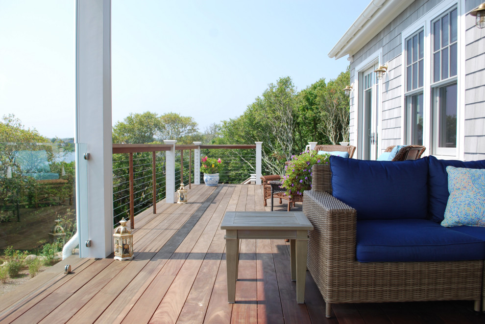 Inspiration for a large beach style backyard and first floor deck in Providence with with privacy feature, no cover and mixed railing.