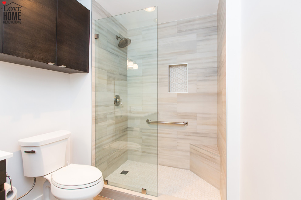 This is an example of a large modern 3/4 wet room bathroom in Los Angeles with flat-panel cabinets, brown cabinets, a two-piece toilet, beige tile, wood-look tile, white walls, ceramic floors, an undermount sink, beige floor, an open shower, white benchtops, a single vanity and a built-in vanity.