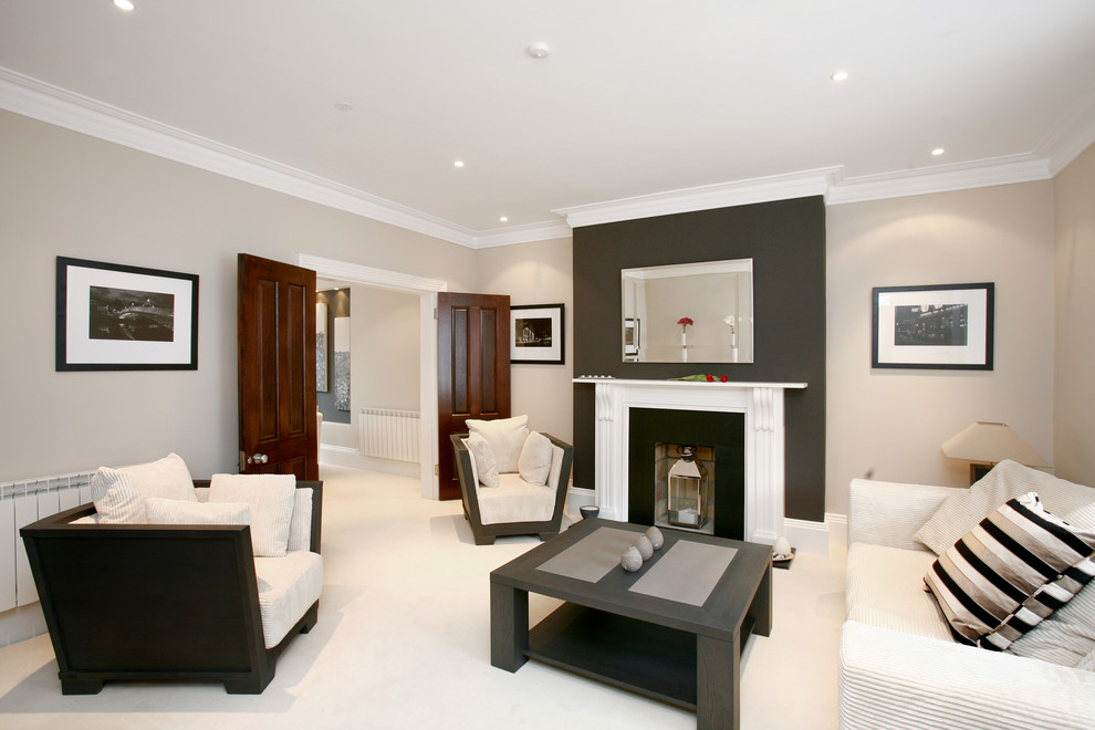 Contemporary living room in Dublin With Multi-coloured Walls, Carpet, a Standard Fireplace, a Plastered Fireplace Surround and White Floors.