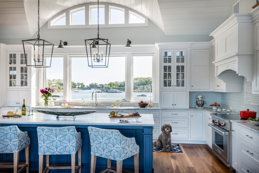 Design ideas for a beach style l-shaped kitchen in Boston with an undermount sink, shaker cabinets, white cabinets, grey splashback, stainless steel appliances, dark hardwood floors, with island, brown floor, grey benchtop and timber.