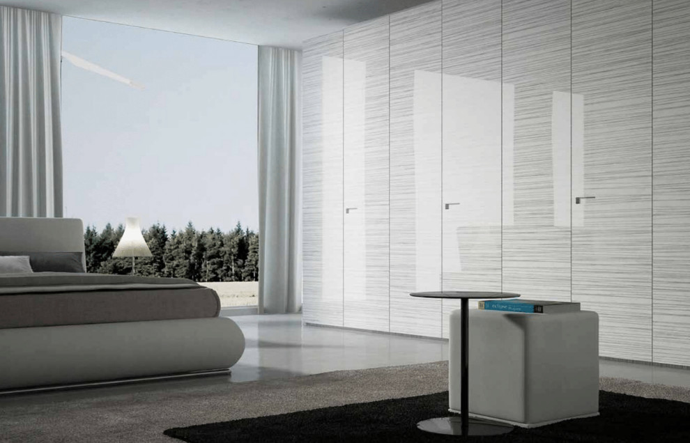Inspiration for a large modern master concrete floor and gray floor bedroom remodel in Hawaii with no fireplace