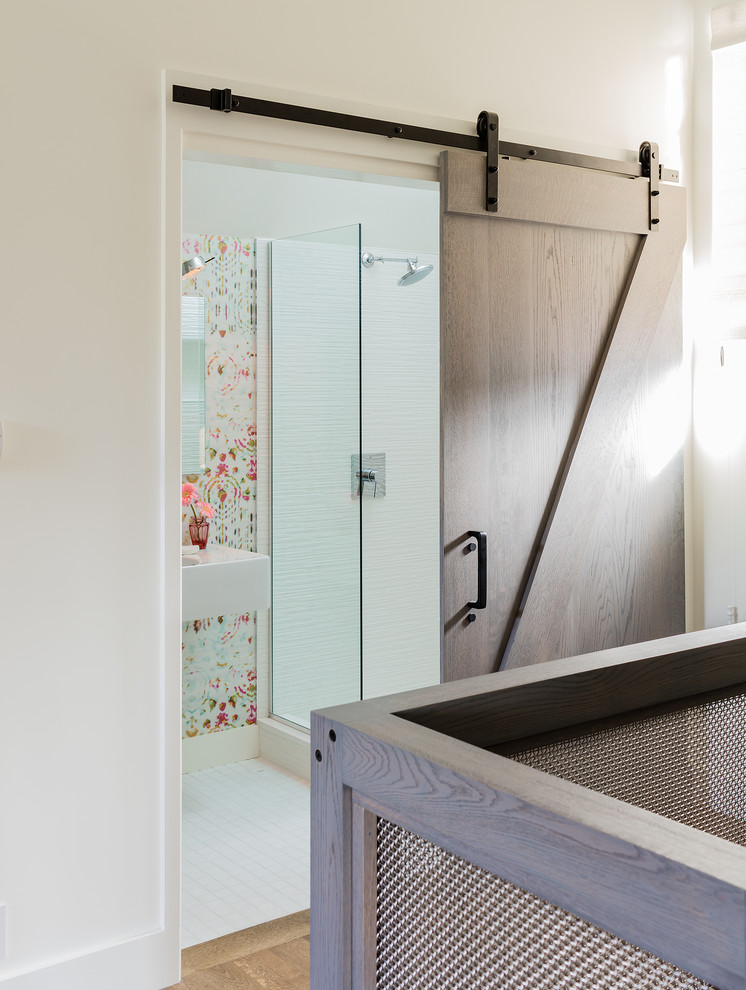 Photo of a mid-sized eclectic master bathroom in Boston with an open shower, a wall-mount toilet, white tile, ceramic tile, multi-coloured walls, marble floors, a wall-mount sink, white floor and a hinged shower door.