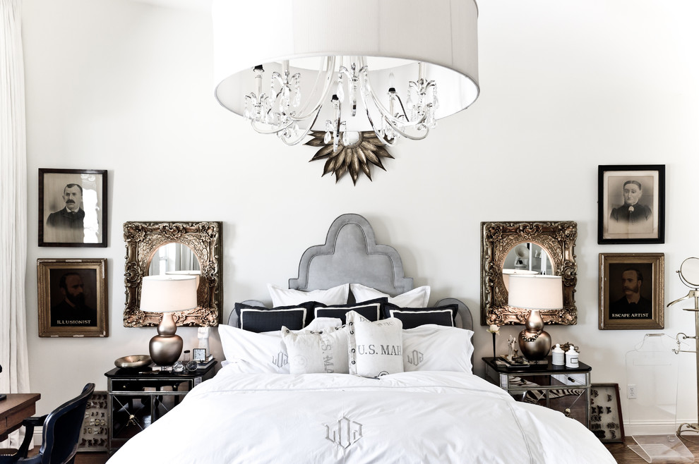 This is an example of an eclectic master bedroom in Dallas with white walls.