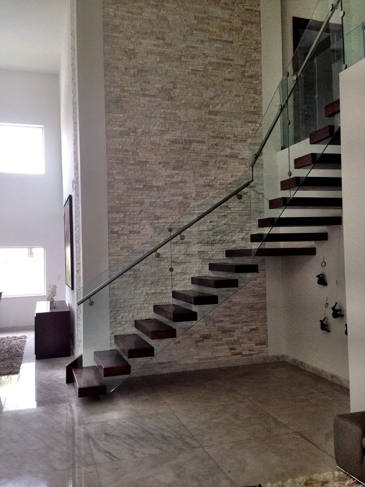 Inspiration for a large transitional wooden l-shaped open staircase remodel in Miami