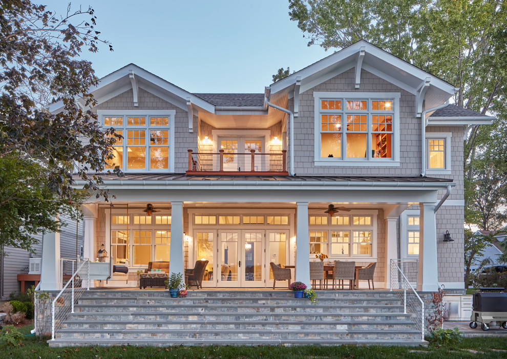 This is an example of a large beach style two-storey exterior in Baltimore with wood siding.