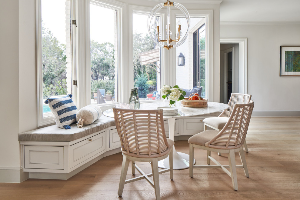 Example of a mid-sized transitional medium tone wood floor breakfast nook design in Austin