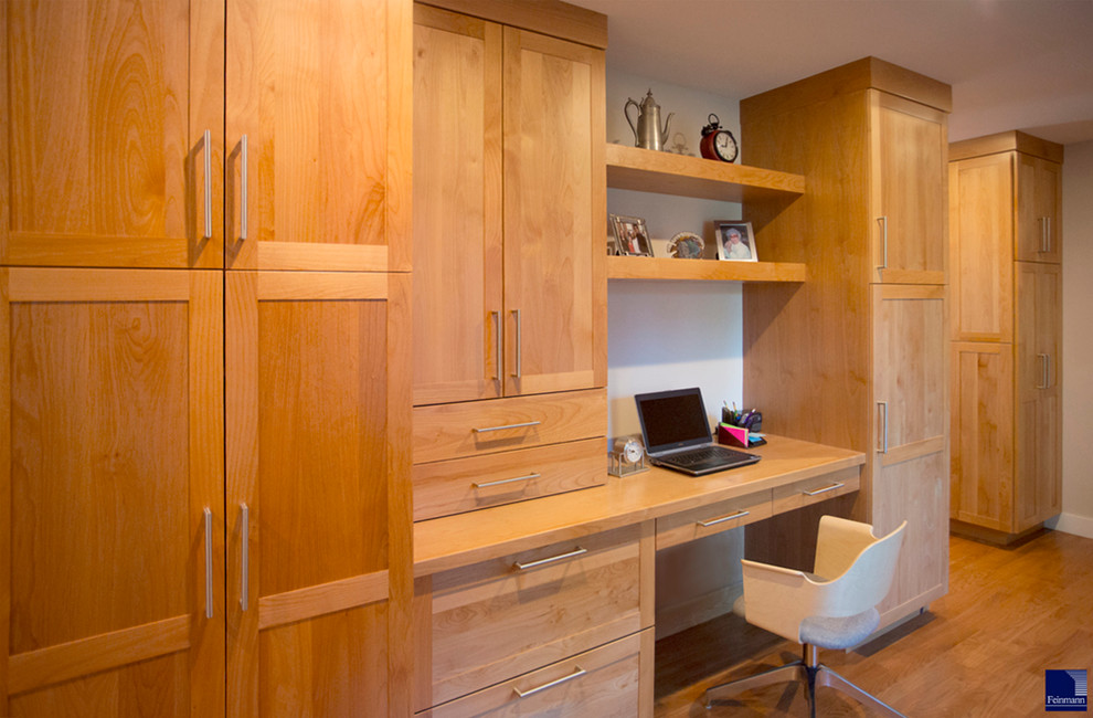 Photo of a mid-sized transitional home office in Boston with medium hardwood floors and a built-in desk.