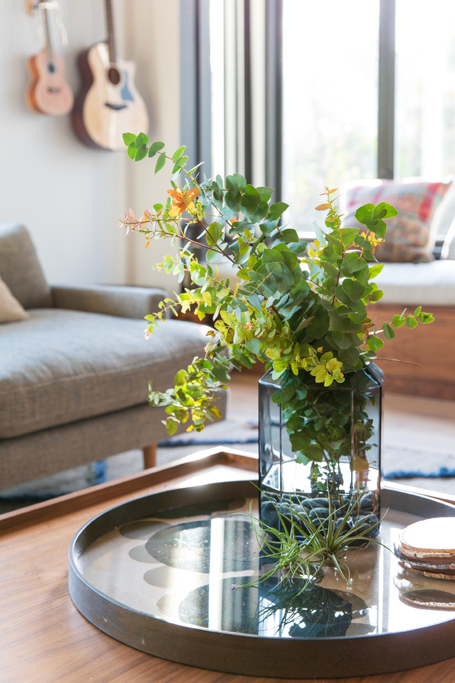 Inspiration for a large contemporary light wood floor family room remodel in San Francisco with white walls