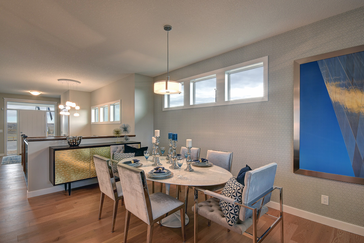 Great room - mid-sized transitional light wood floor and beige floor great room idea in Calgary with blue walls and no fireplace