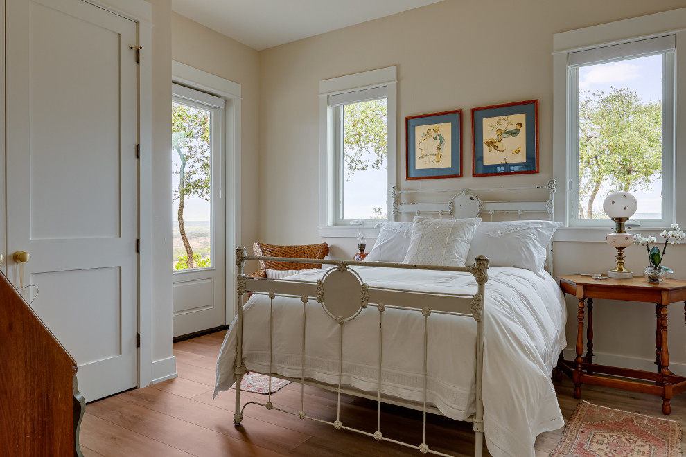 Farmhouse guest light wood floor bedroom photo in Austin