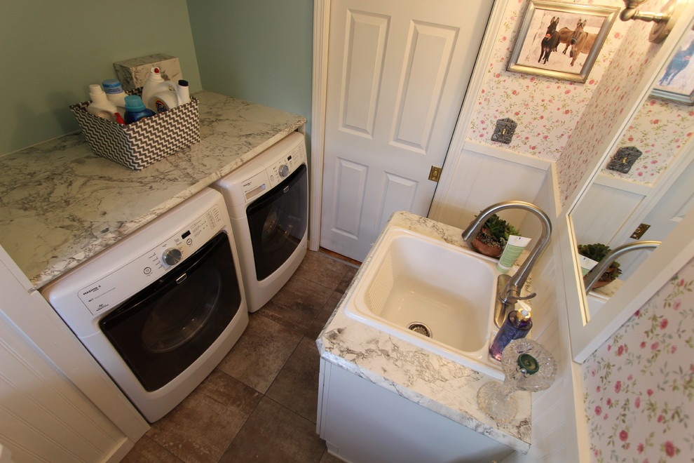 Photo of a small country 3/4 bathroom in Cleveland with a drop-in sink, recessed-panel cabinets, white cabinets, a two-piece toilet, white tile, green walls and a laundry.