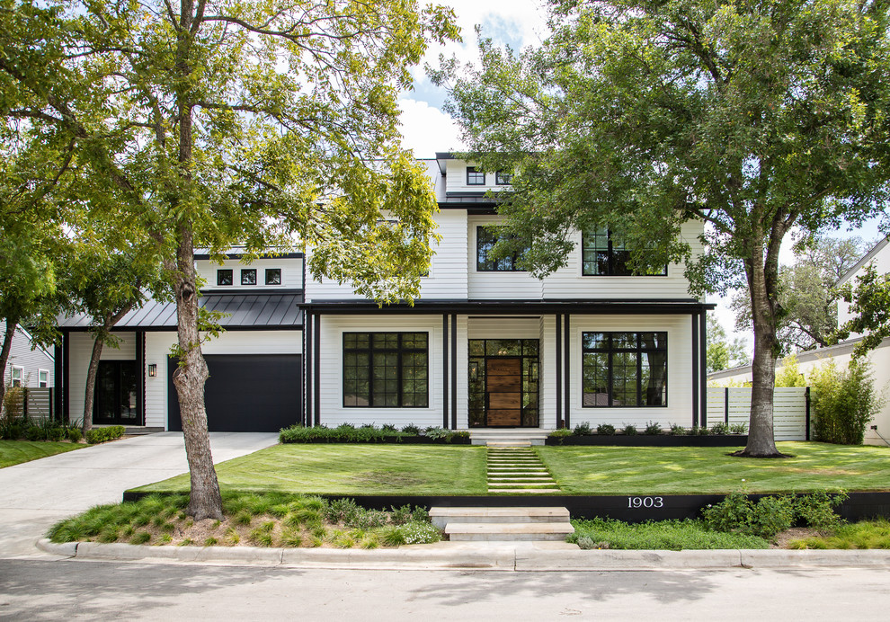 This is an example of a traditional two-storey white exterior in Austin.
