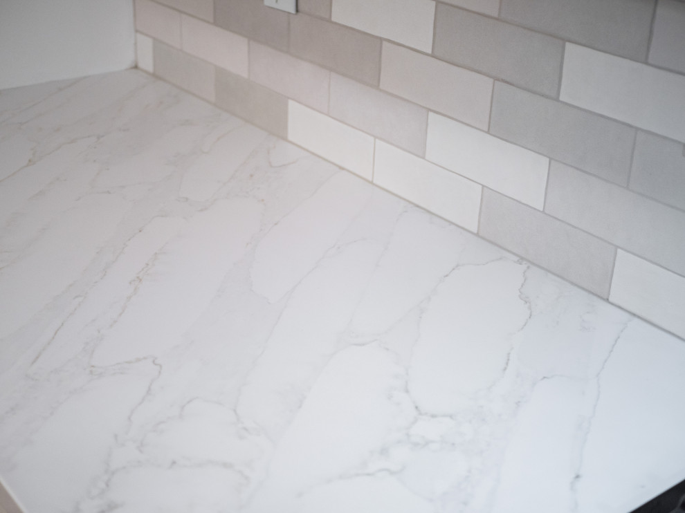 Inspiration for a small transitional galley eat-in kitchen remodel in Columbus with shaker cabinets, white cabinets, quartz countertops and white countertops