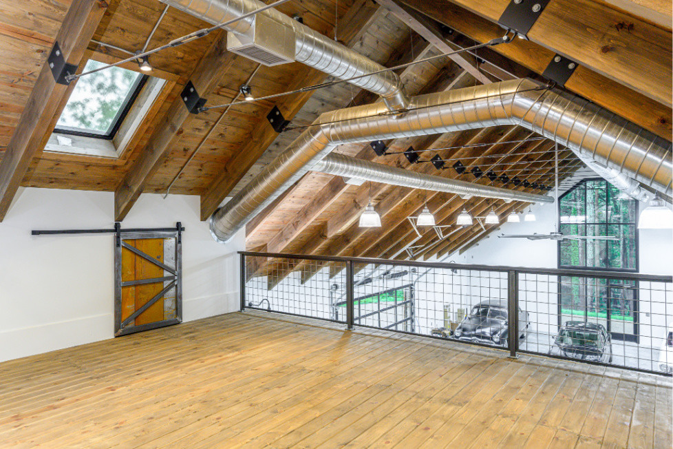 Inspiration for an expansive industrial detached four-car workshop in Other.