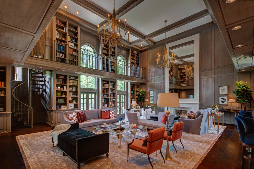 Inspiration for an expansive traditional loft-style family room in Houston with a library, brown walls, dark hardwood floors, a standard fireplace and brown floor.