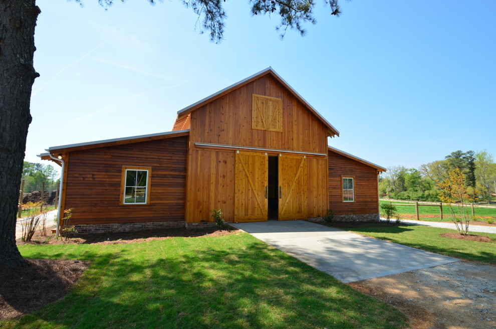This is an example of a mid-sized traditional detached barn in Atlanta.