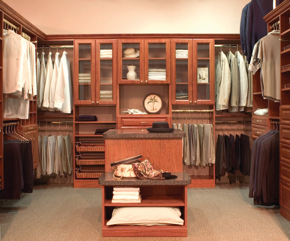 Inspiration for a traditional walk-in wardrobe in Dallas with raised-panel cabinets.
