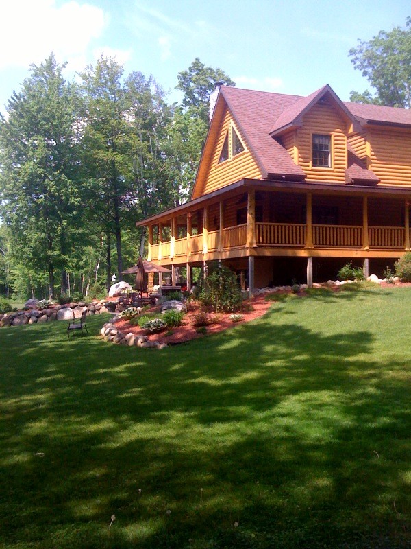 Design ideas for a country exterior in Detroit with wood siding.
