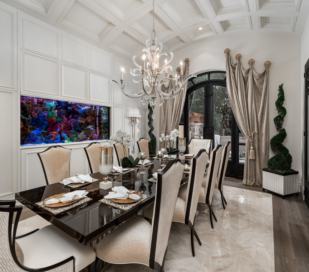 This is an example of a large modern separate dining room in Phoenix with beige walls, marble floors and white floor.