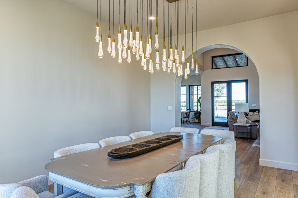 Dining Room with Chandelier and View to the Great Room | Tuscan Farmhouse