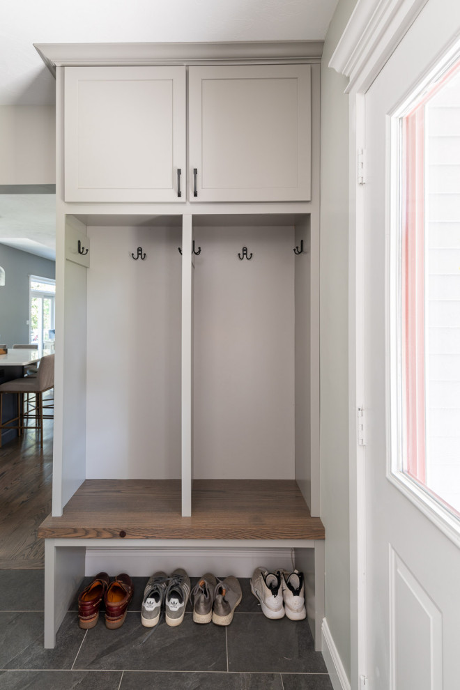 Mudroom - small transitional porcelain tile and gray floor mudroom idea in Boston with gray walls