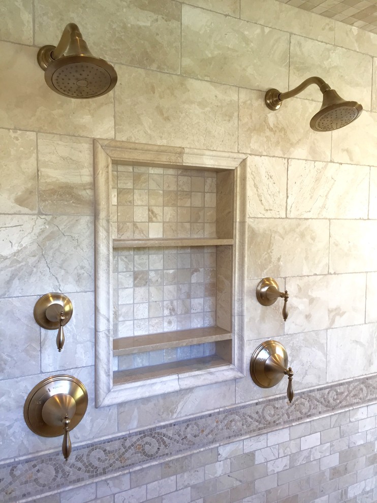 This is an example of a large transitional master bathroom in Phoenix with furniture-like cabinets, distressed cabinets, a claw-foot tub, a double shower, a two-piece toilet, beige tile, stone tile, beige walls, travertine floors, a trough sink, quartzite benchtops, beige floor, a hinged shower door and brown benchtops.