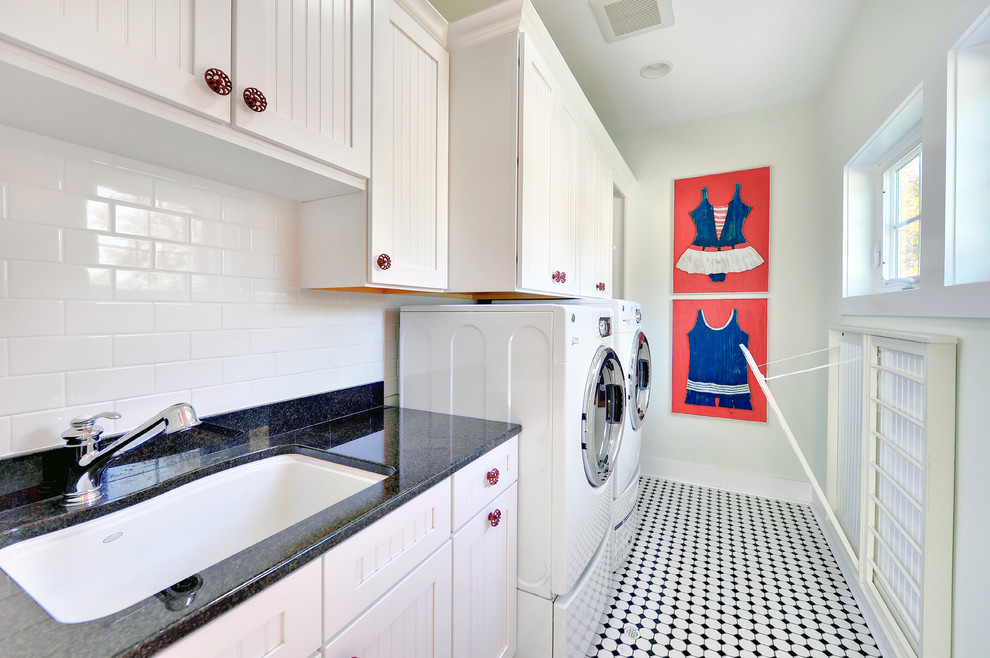 Design ideas for a beach style laundry room in Philadelphia with white cabinets and multi-coloured floor.