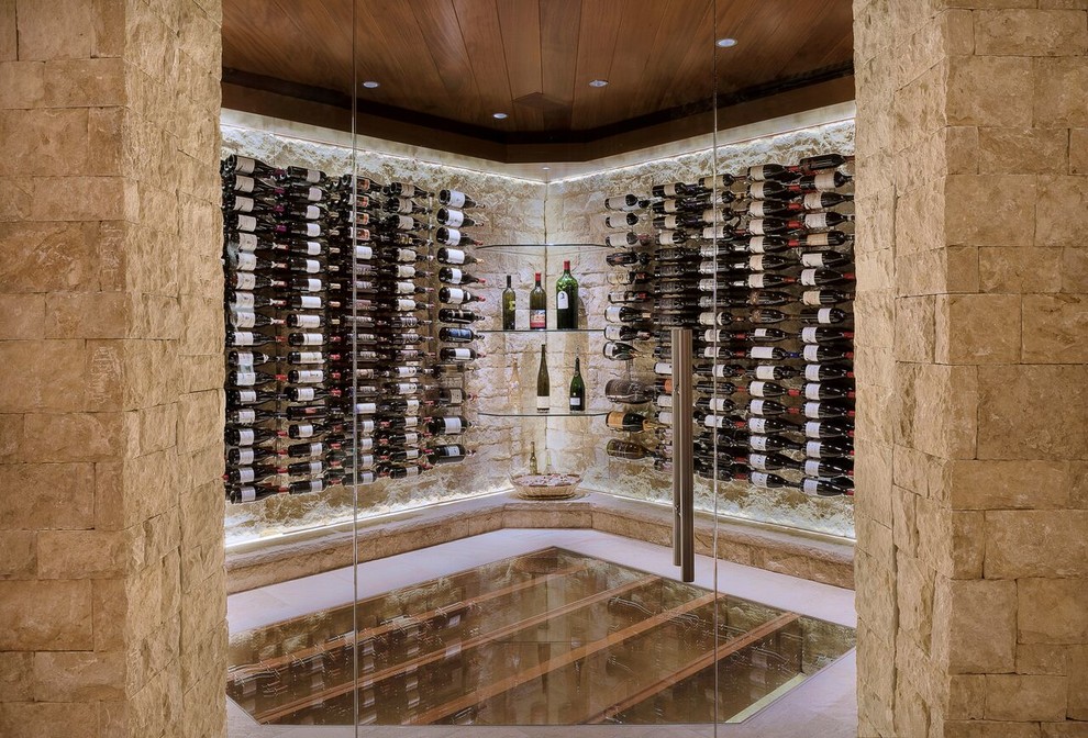 Large traditional wine cellar in Denver with display racks.