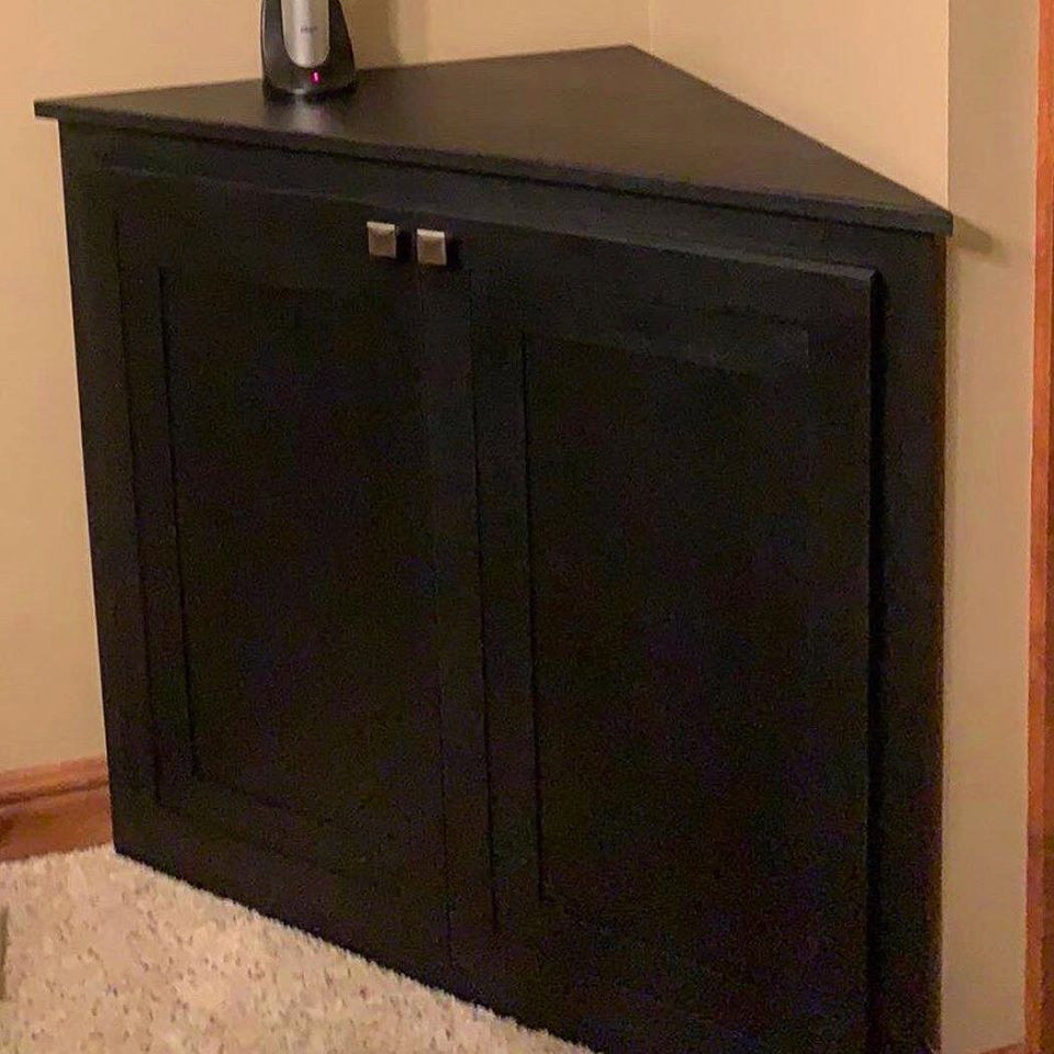 Photo of a small contemporary home bar in Other with black cabinets, wood benchtops and black benchtop.