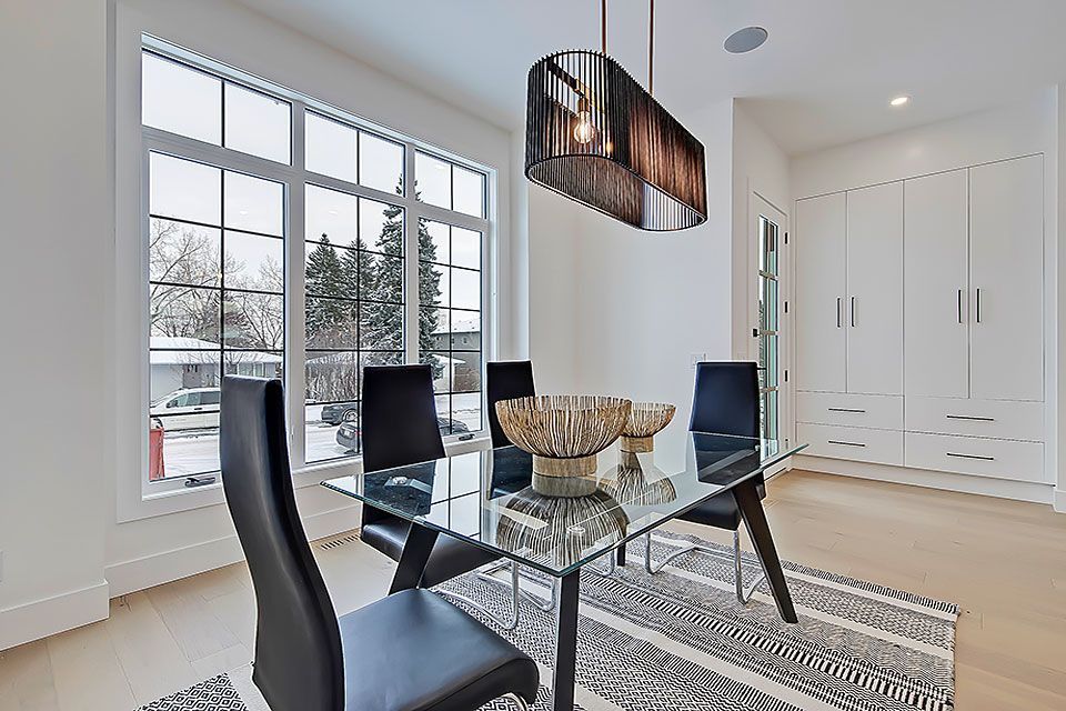 Example of a transitional home design design in Calgary