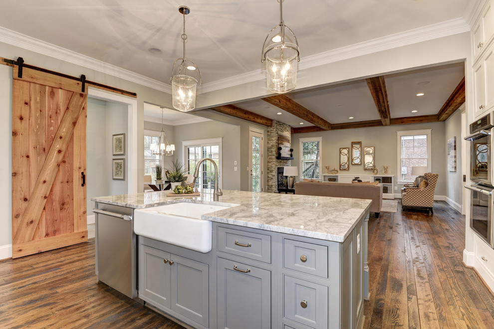Inspiration for a large arts and crafts l-shaped open plan kitchen in DC Metro with a drop-in sink, flat-panel cabinets, white cabinets, granite benchtops, white splashback, subway tile splashback, stainless steel appliances, dark hardwood floors and with island.