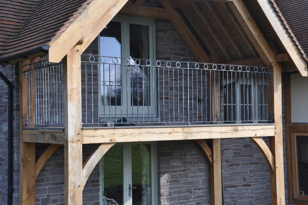 This is an example of a mid-sized contemporary balcony in Other with metal railing.