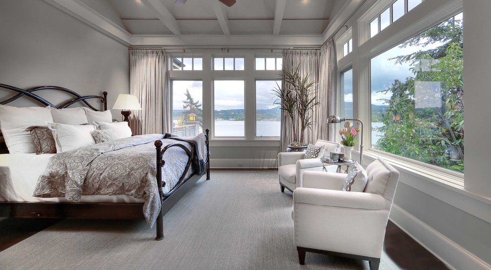 Inspiration for a large traditional master bedroom in Seattle with grey walls, dark hardwood floors and no fireplace.