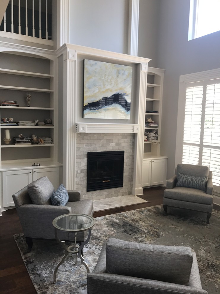 Design ideas for a mid-sized transitional formal open concept living room in Dallas with blue walls, dark hardwood floors, a standard fireplace, a tile fireplace surround, a built-in media wall and brown floor.