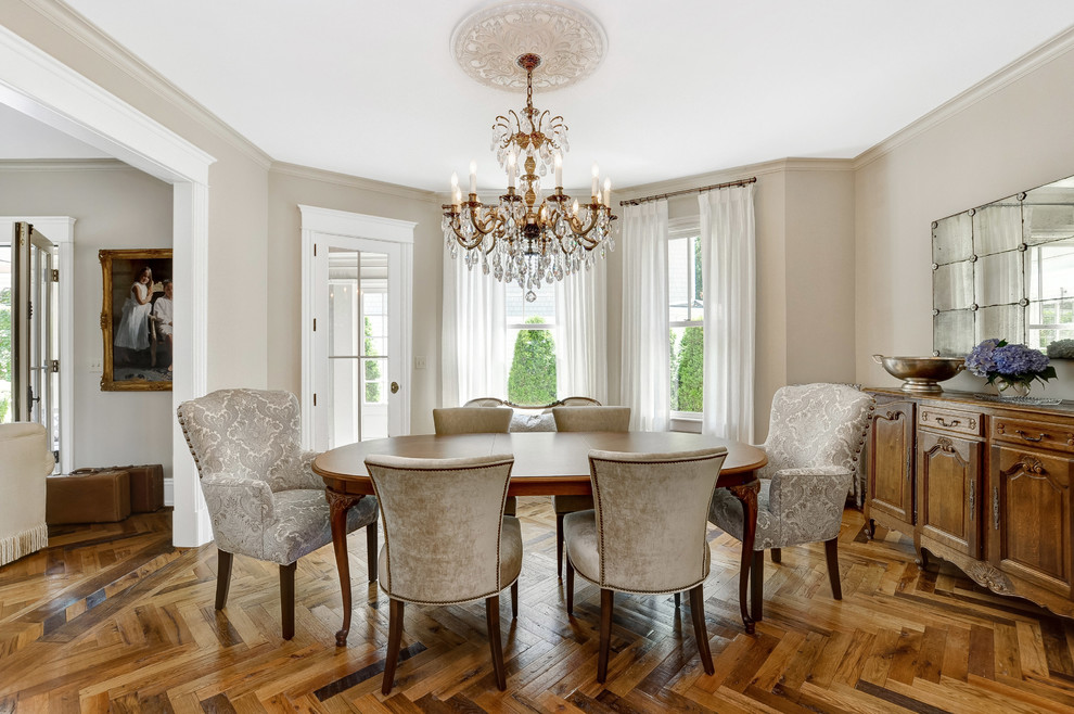 Design ideas for a traditional dining room in New York with beige walls, medium hardwood floors and brown floor.
