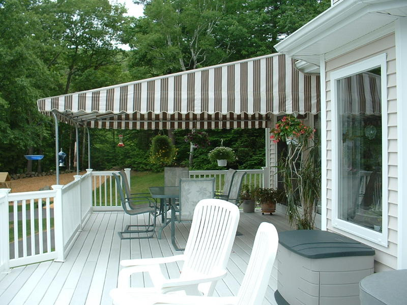 Inspiration for a large traditional backyard deck in Bridgeport with an awning.