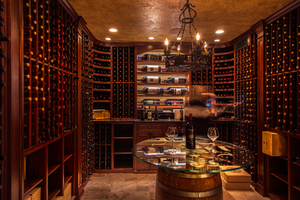 Design ideas for a mid-sized traditional wine cellar in DC Metro with storage racks, limestone floors and beige floor.