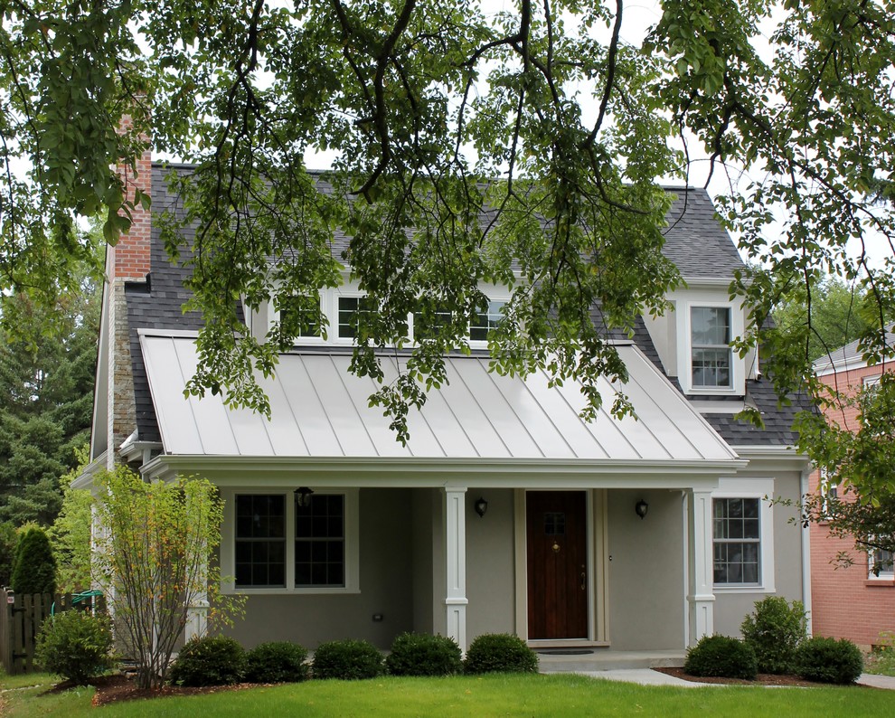 Mid-sized transitional beige two-story stucco gable roof idea in Chicago with a mixed material roof and a gray roof