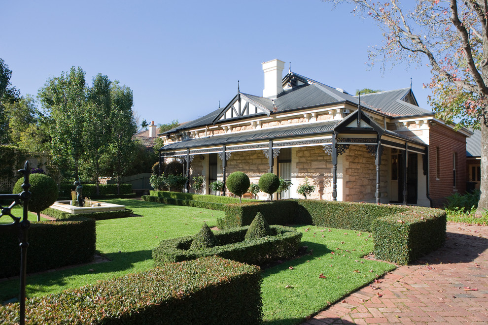 Photo of a large traditional side yard full sun driveway in Adelaide with a garden path and brick pavers.