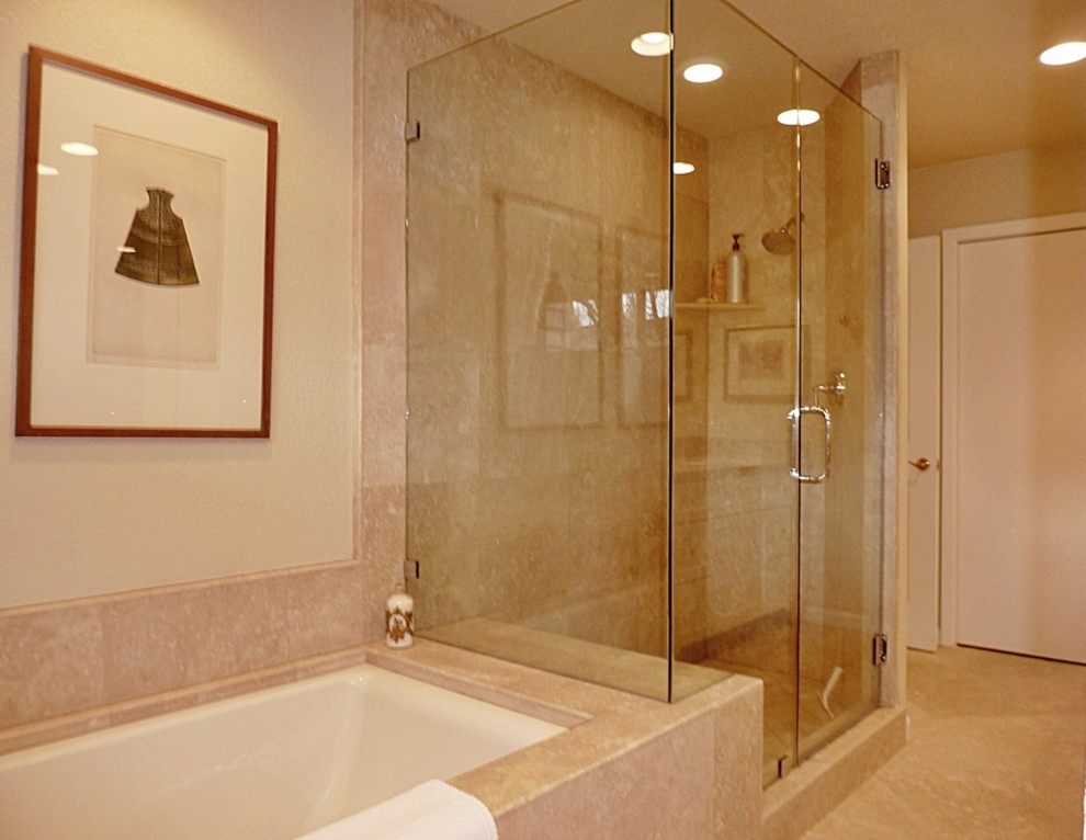 Photo of a large traditional ensuite bathroom in Sacramento with a submerged sink, recessed-panel cabinets, white cabinets, limestone worktops, a submerged bath, a double shower, a one-piece toilet, multi-coloured tiles, ceramic tiles, white walls and limestone flooring.