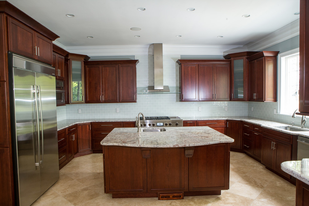Photo of an expansive transitional u-shaped eat-in kitchen in DC Metro with an undermount sink, dark wood cabinets, granite benchtops, glass tile splashback, stainless steel appliances, marble floors and with island.