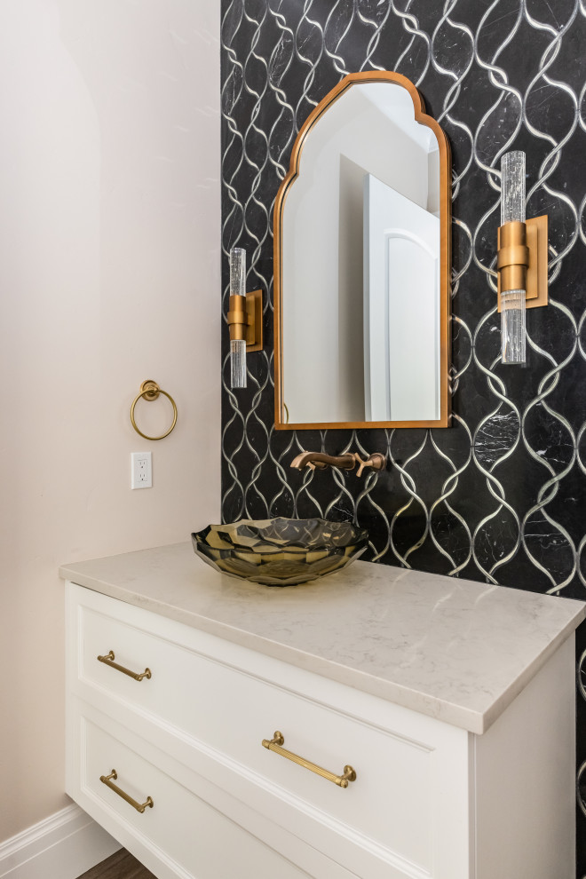 This is an example of a medium sized classic cloakroom in Salt Lake City with recessed-panel cabinets and a floating vanity unit.