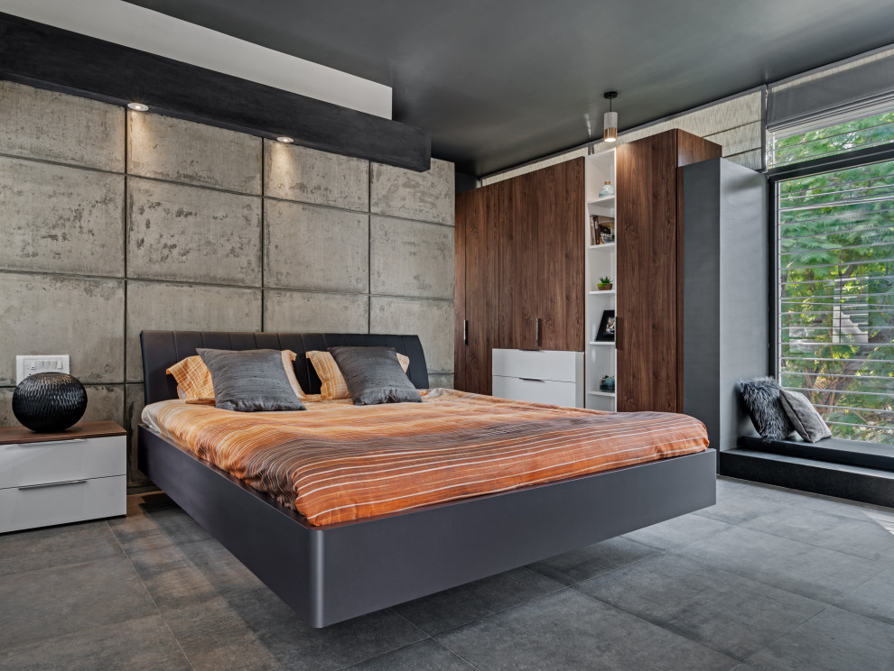Expansive contemporary master bedroom in Bengaluru with grey walls and grey floor.