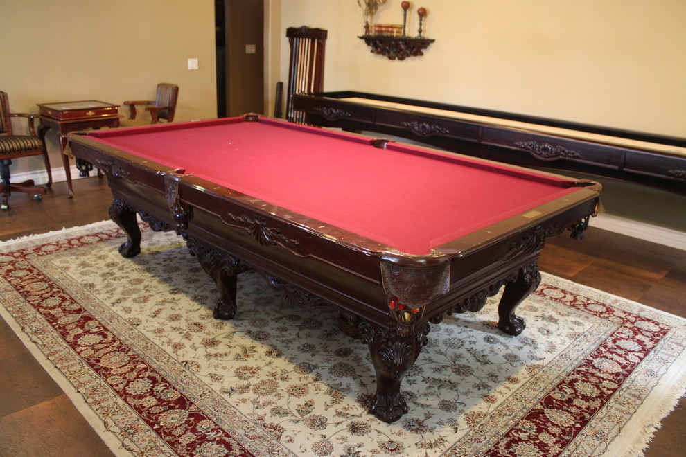 This is an example of a mid-sized traditional enclosed family room in Orange County with a game room and beige walls.