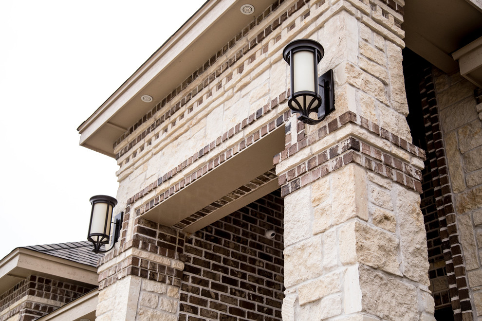 Inspiration for a large transitional one-storey brick beige exterior in Austin with a hip roof.