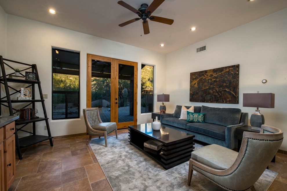 Mid-sized contemporary enclosed living room in Phoenix with a home bar, beige walls, porcelain floors, no fireplace, no tv and brown floor.